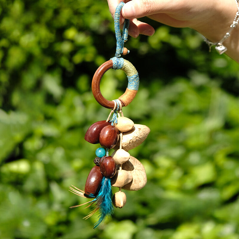 Feather-Chime Delight Nut Shell Ornament